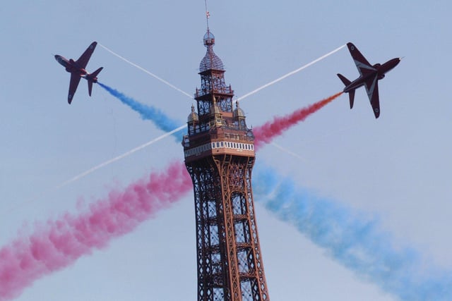 Superb photo of the magnificent Red Arrows making a spectacular appearance behind the Tower