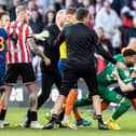 Lavery was sent off after being wrestled to the floor by Wes Foderingham after the game on Saturday