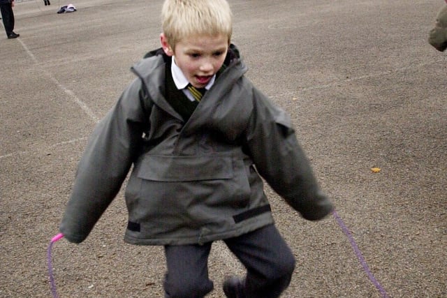 Playground games at St John Vianney School - six-year-old Tim Dunn skipping