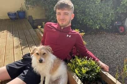 Harrison Bretherton, 21, with his beloved dog, Jack