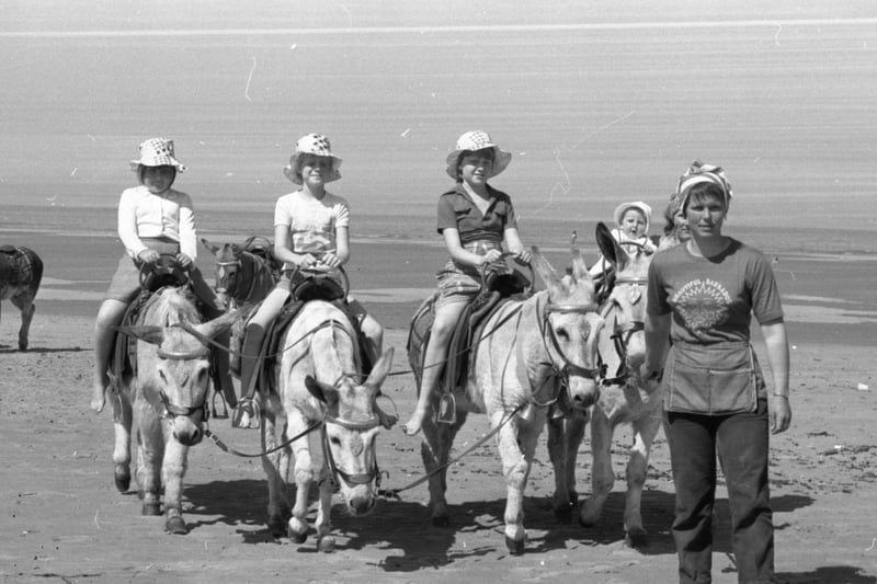 Sandra Betteridge of Blackpool takes her young customers for a donkey ride