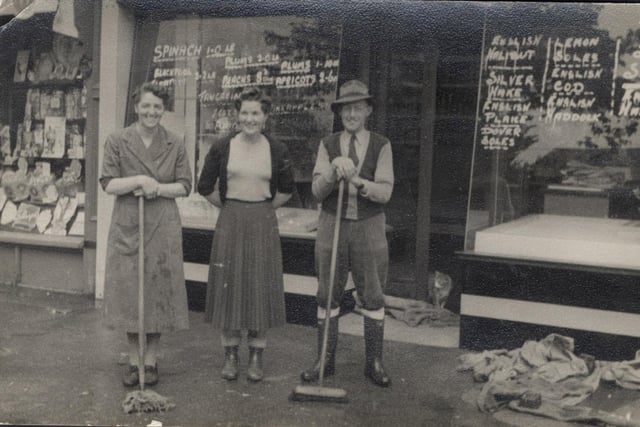 John Fish with parents Ida and John outside their shop with Mrs Lancaster