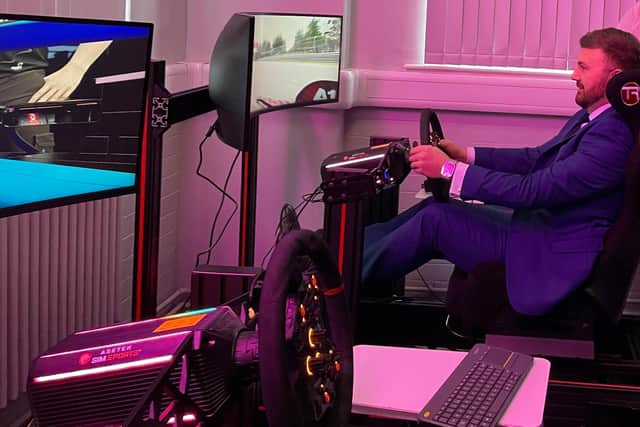 Chris Webb tries out a driving simulator at the L&C IoT's Blackpool and the Fylde College site