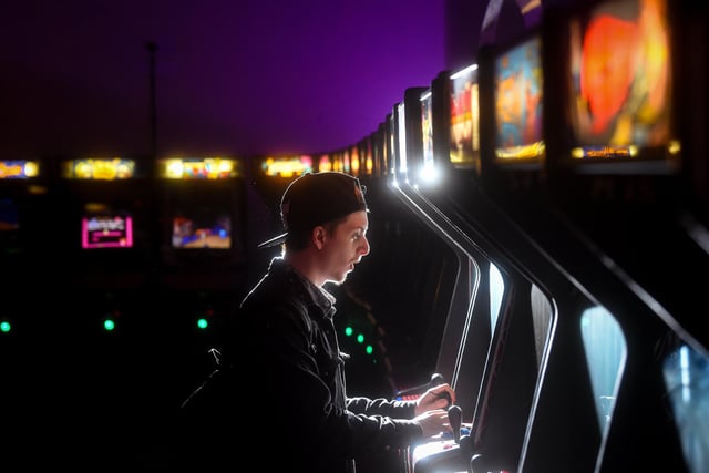 Clifford Young enjoying one of the hundreds of games the Arcade Club has to offer.