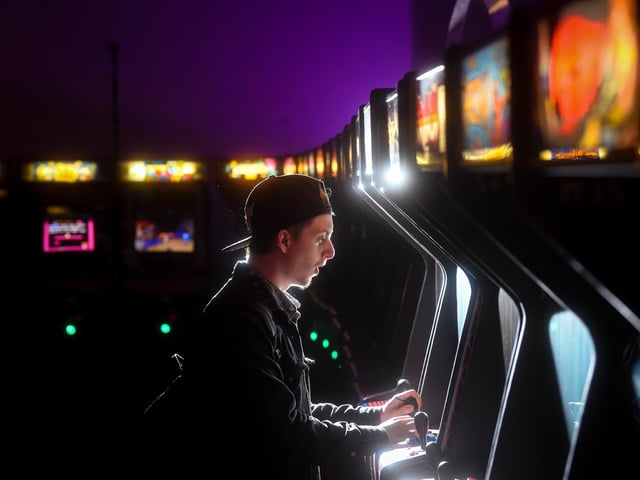 Clifford Young enjoying one of the hundreds of games the Arcade Club has to offer.