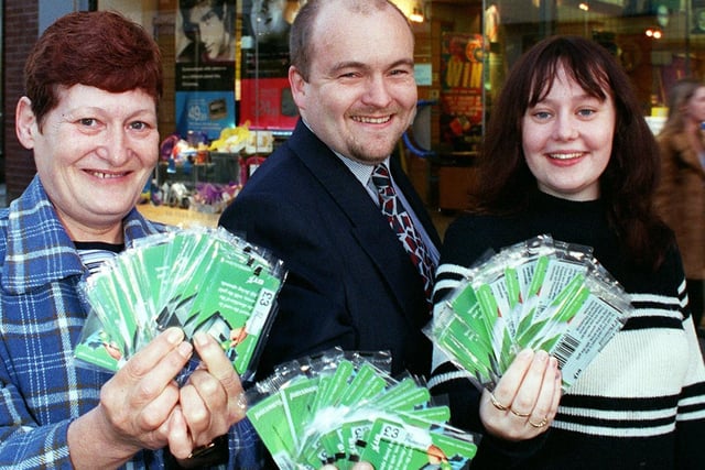 Blackpool BT Shop manager Steve Parkinson handed over 200 BT Phonecards to Single Homeless Project volunteers Ellen Warburton (left) and Helen Runeckles ' for the Gazette United for Christmas Appeal in 1998