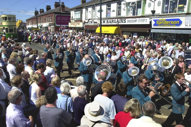 Crowds watch the procession in Lord Street in 2002. Remember the shops in the background?