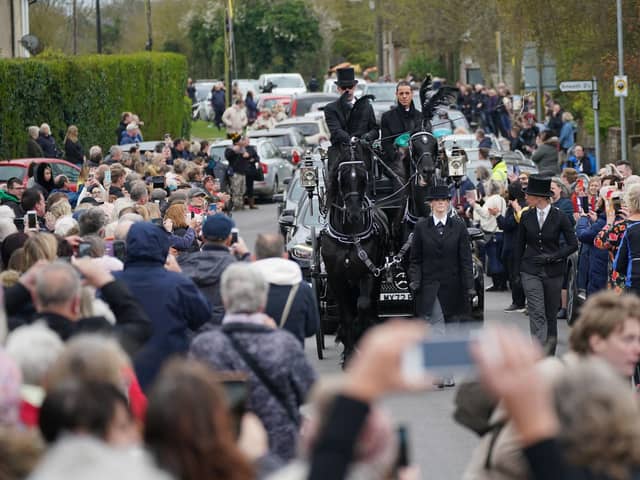 The funeral cortege of Paul O'Grady travels through the village of Aldington, Kent ahead of his funeral at St Rumwold's Church.