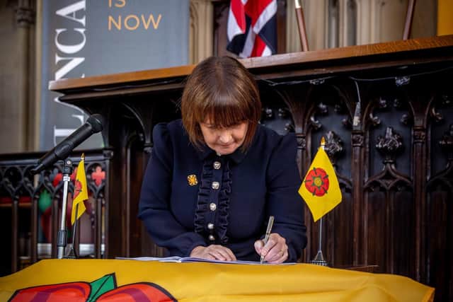 County Cllr Philllippa Williamson putting her name to the provisional devolution deal in Lancaster late last year - but will it now come to pass in its current form?