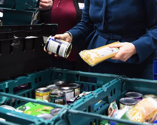File photo dated 17/01/18 of goods at a food bank. The cost-of-living crisis is driving food banks to "breaking point" with almost 1.3 million emergency parcels given to people in hunger over just six months, a leading charity has said. Issue date: Thursday November 10, 2022. PA Photo. The Trussell Trust issued a stark warning on Thursday after new research showed record-breaking levels of need, with one in five individuals referred to its network now coming from working households. See PA story CHARITY Foodbanks. Photo credit should read: Andy Buchanan/PA Wire 