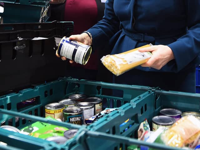 File photo dated 17/01/18 of goods at a food bank. The cost-of-living crisis is driving food banks to "breaking point" with almost 1.3 million emergency parcels given to people in hunger over just six months, a leading charity has said. Issue date: Thursday November 10, 2022. PA Photo. The Trussell Trust issued a stark warning on Thursday after new research showed record-breaking levels of need, with one in five individuals referred to its network now coming from working households. See PA story CHARITY Foodbanks. Photo credit should read: Andy Buchanan/PA Wire 