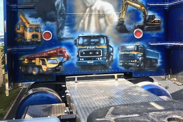 The Peterbilt truck with the artwork of company founder Harold Fox, known as HF, painted on it