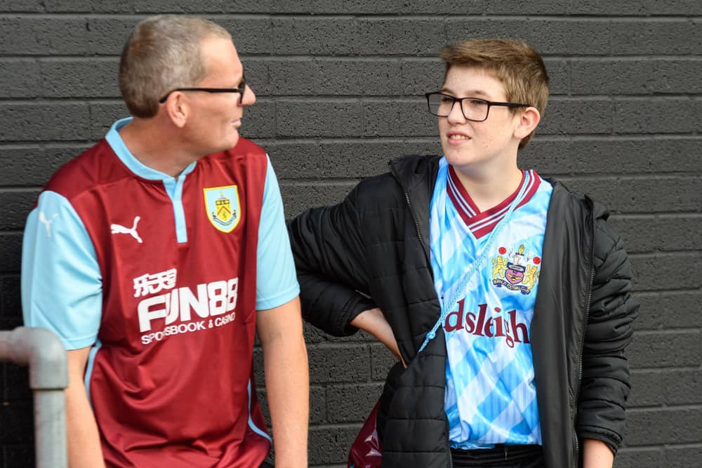 Burnley fans arrive at Turf Moor ahead of the Lancashire Derby with Blackpool. Photo: Kelvin Stuttard