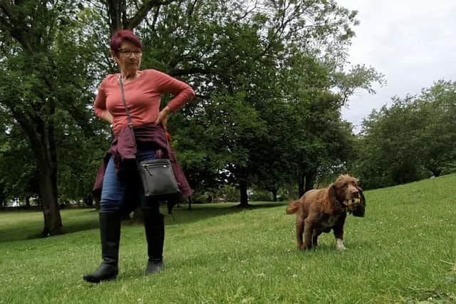 Dog owner Irene with spaniel Olly, says it is unfair to penalise responsible walkers who behave well off the lead