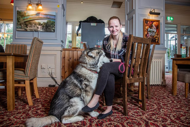 Heather Porter-Brandwood, general manager, with her dog Maia, 10, an Alaskan Malamute.