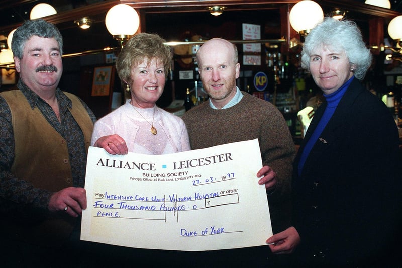 Landlady Eileen McPhee of the Duke of York pub in Dickson Rd presenting a cheque for £4000 to Blackpool Victoria Hospital ICU in 1997
With her are Mike Rossi, Consultant Intensive Care Dr Nigel Randall and senior Nurse manager Intensive care Cath Morgan