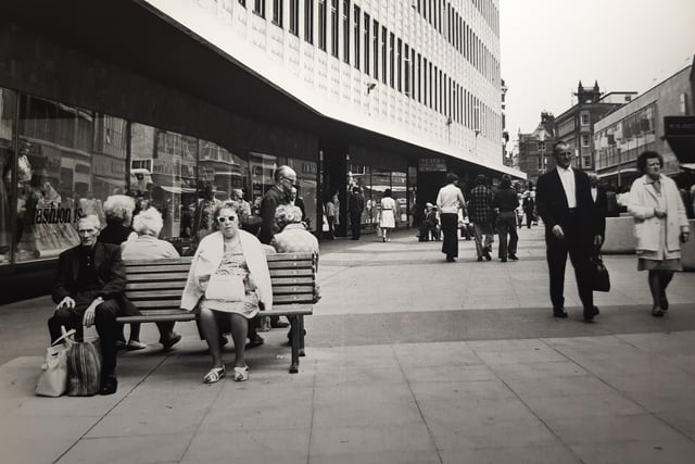 The imposing Lewis's building and shoppers taking the weight off their feet. This could possibly be the 1970s rather than 80s