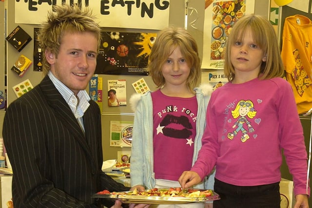 Family physical fitness fun day at Claremont Primary School in Blackpool. L-R are Ciaran Donnelly holding a tray of fruit at a healthy eating stall. Next to him are Kirsty Hale (middle) and Sophie Bickerdike who were both nine.