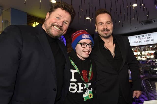 Fan-tastic. Michael Ball and Alife Boe launch their new album at Viva Vegas Diner and Bar, Blackpool - as they pose for photographs before a show for fans. Here one lucky fan meets the duo.