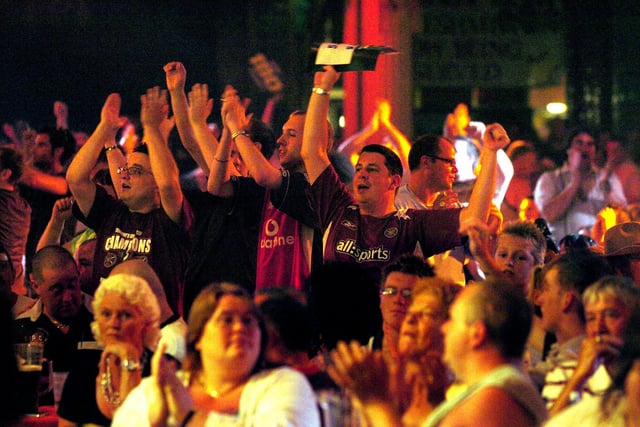 Audience members shout their support at the Stan James World Matchplay Darts at the Winter Gardens' Empress Ballroom, Blackpool