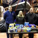 The food donations are presented to Joanne Hutchinson, preacher at St John the Devine by Lytham St Annes RNLI crew members (from left) Chris Penrice (mechanic), Mike Gee (navigator) and Roy Black (SLRS driver).