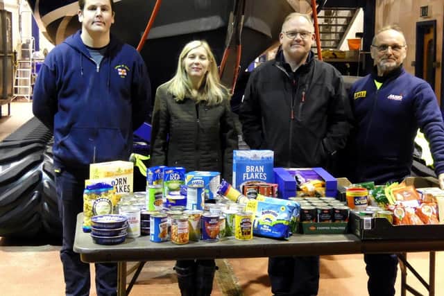 The food donations are presented to Joanne Hutchinson, preacher at St John the Devine by Lytham St Annes RNLI crew members (from left) Chris Penrice (mechanic), Mike Gee (navigator) and Roy Black (SLRS driver).