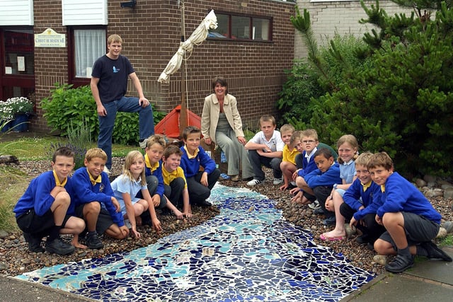 Pupils at St Peters Catholic Primary School made a 'Garden for St Peter' in the school grounds. Also pictured are parent Cath Powell (who landscaped the garden) and Joseph Thompson from the Art Lounge