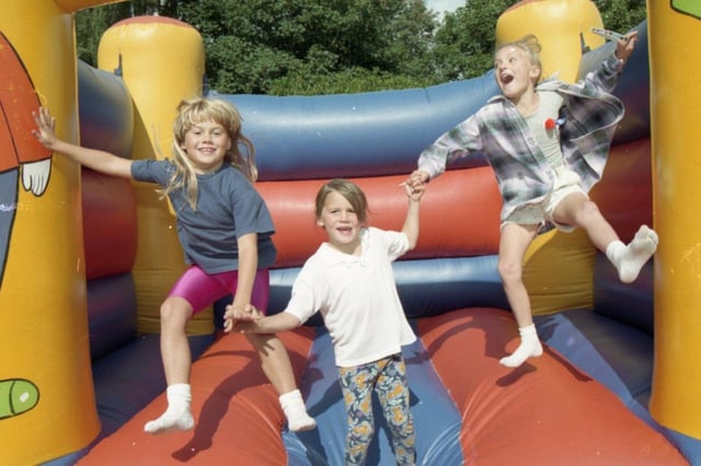 Youngsters bounced the afternoon away at a garden party at St Michaels on Wyre, held to raise money for arthritis charities. From the left, Laura Ward, eight and her sister Gillian, six, and Clare Haslem, eight, jump for joy on the bouncy castle