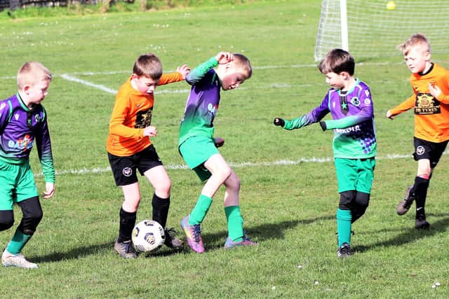 Under-8s' match of the week action between YMCA Blacks and St Annes Greens  Pictures: B&DYFL