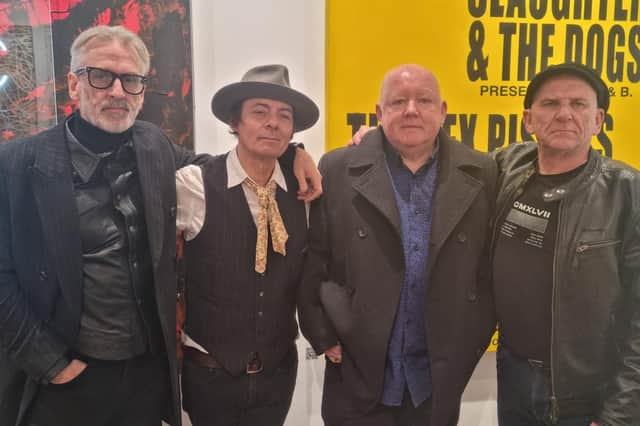 Mick Rossi in hat and Maurice Murray (second right) with Slaughter and the Dogs original drummer and bass player during the exhibition launch in London