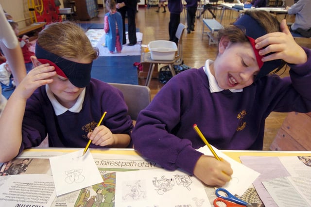 Pupils from St Wulstan's RC school, Fleetwood, taking part in The Big Draw. Pictured: Courtenay Jackson and Louise Ward take a peek whilst blind drawing