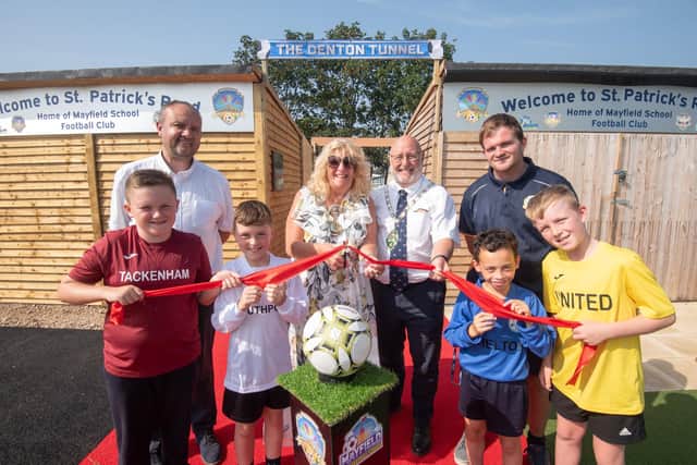 Fylde mayor Coun Cheryl Little officially opens Mayfield Primary School's new football stadium, with consort Paul Little, accompanied by headteacher Glyn Denton, site supervisor Alan Smith and pupils.