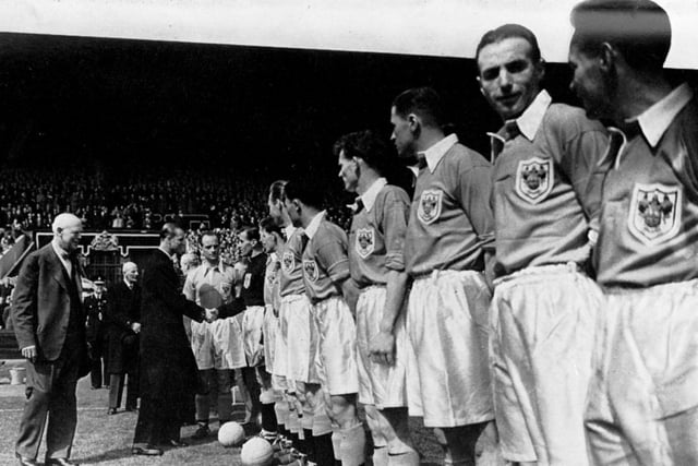 The Duke of Edinburgh meets the Blackpool team prior to kick-off