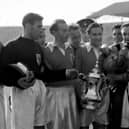 Stanley Matthews and his Blackpool teammates celebrate with the cup