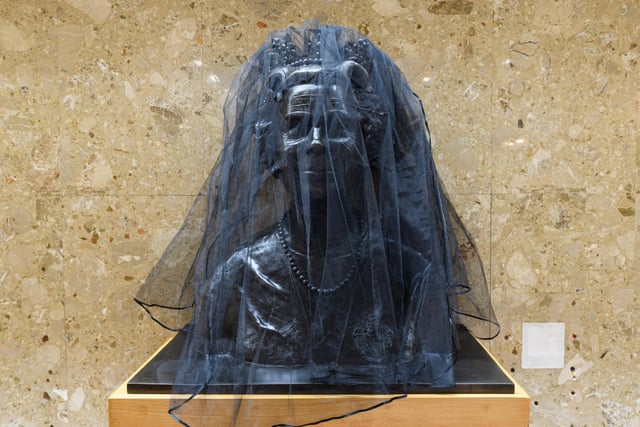 Bust of Queen Elizabeth II is covered in a black mesh at Wyre Civic Centre following her death last week. Photo: Kelvin Stuttard