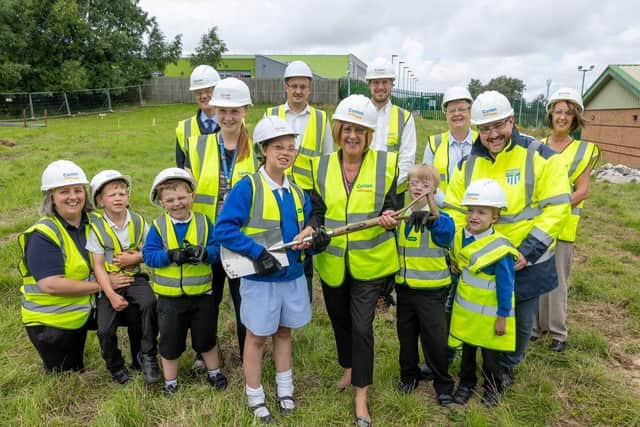 Coun Kath Benson with pupils and staff at the site