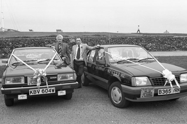 Two of the fleet cars dressed up for the opening of Fleetwood taxi co-operative