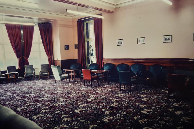 High ceilings and flooded with natural light, the rooms were enormous. This was presumably a communal sitting room