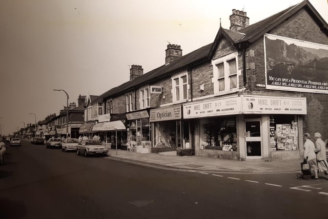 Highfield Road in May 1990 at the junction with Ash Street. Mike Swift DIY and an Opticians dominate the scene