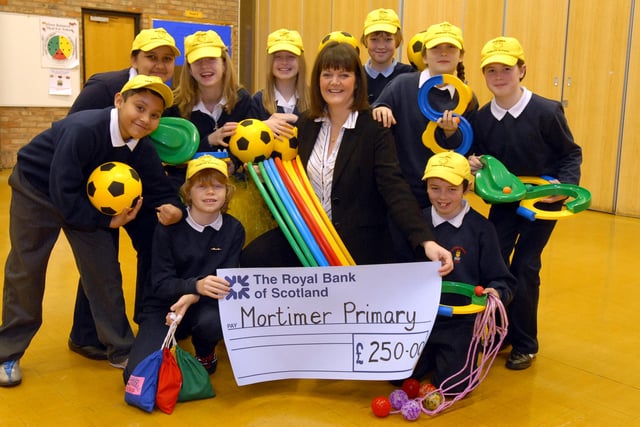 These playground buddies from Mortimer Primary School were pictured receiving a cheque in 2007 but who can tell us more about the occasion?