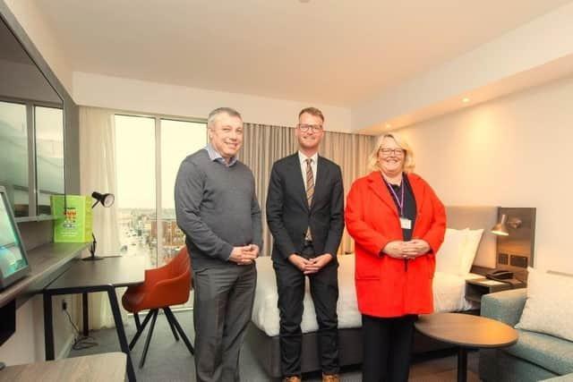 Councillor Mark Smith, Holiday Inn general manager Mark Winter and Councillor Lynn Williams inside the new Holiday Inn