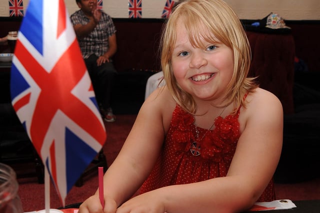The Dinmore pub on Grange Park hosted a Diamond Jubilee party in 2012. Pictured making herself a crown is Regan Blackburn-Campbell who was nine