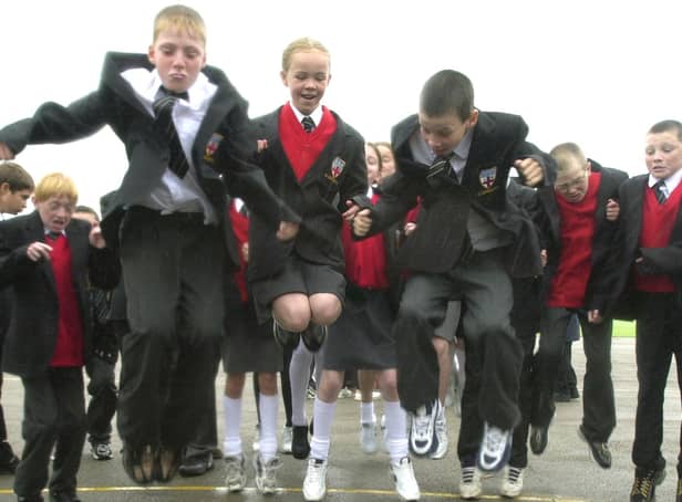 Pupils are pictured taking part in the world record jump bid, 2001