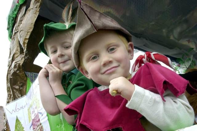In charge on the back of the Hummingbirds Nursery float, little poser Sam Carr with friend James Tomlinson, both aged four, set off in the Children's Festival parade in Garstang