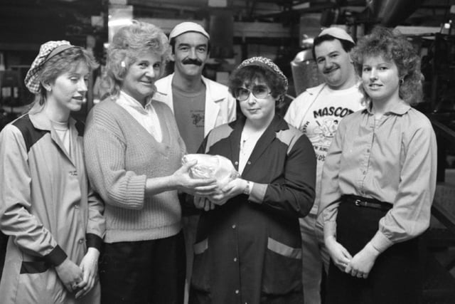 Staff at a Kirkham crisp factory came up with a surprise packet for a cot death group. Workers at Bensons Crisps, in Marquis Street, raised £600 for the Fylde area Cot Death Group, one of the largest donations it has ever received. Pictured: Pauline Bresnihan (second from right) presenting cash from a fancy dress, three-legged pub crawl organised by the crisp factory staff to Sheila Townsend (second from left) of the cot death group. Also pictured are (from left) Jim Brannigan, Sandra Dickinson, Philip Butcher and Penny Walker