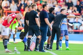 Scott Brown with Paddy Lane, who was sent off in the final moments at Morecambe Picture: ADAM GEE PHOTOGRAPHY