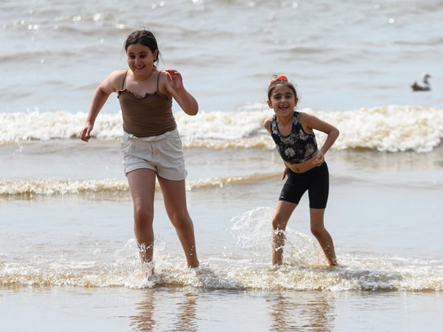 These two youngsters appreciated the chance to cool down with a paddle on the hottest day of the year in Blackpool. Photo: Kelvin Stuttard