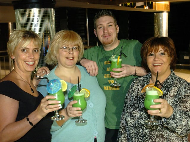 Erica Woods, Diane Woods, barman Rick Platt and Shirley Dawson holding up 'Macmillan Dream' cocktails at Sanuk nightclub in Blackpool. An evening was held at the club which raised £1882.88 for Macmillan Cancer in memory of the late Eva Woods who supported the charity for 20 years