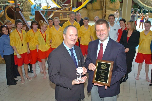 Staff at the Sandcastle Waterworld in Blackpool celebrate winning a prestigious awards at the International World Waterpark Awards 2006. With the awards are managing director John Child, and director Roger Currie