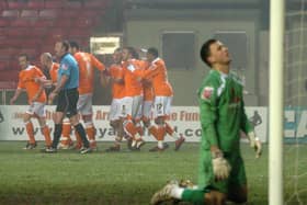 Brett Ormerod is mobbed after scoring the late winning goal